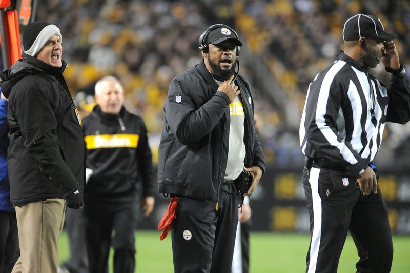 Pittsburgh Steelers head coach Mike Tomlin (center) and vice president and and general manager Kevin Colbert