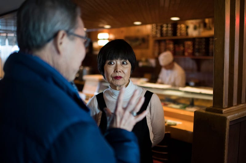 Sagami co-founder Chizuko Fukuyoshi photographed speaking to a customer in 2019.