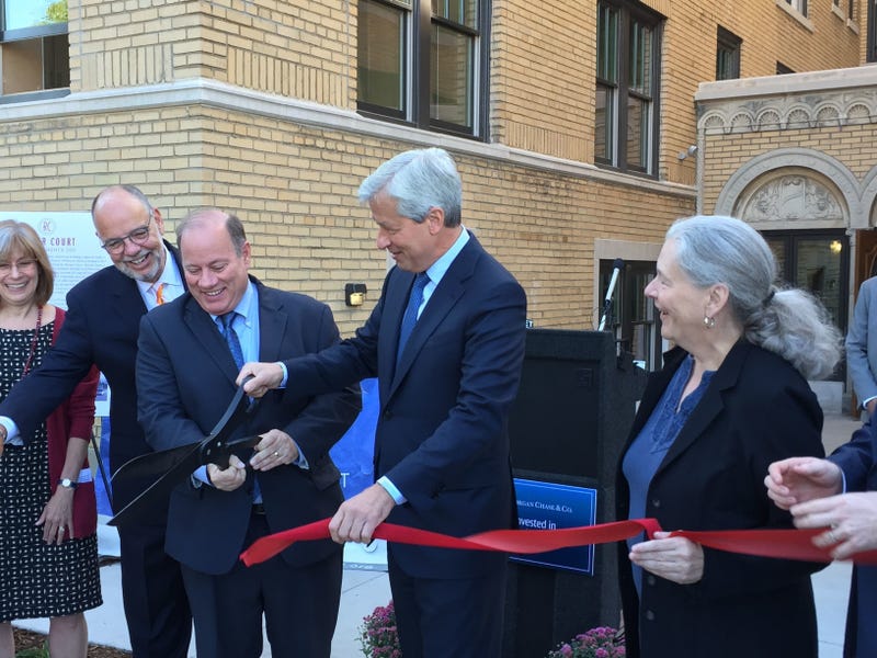 Mayor Mike Duggan is joined by JPMorgan Chase CEO Jamie Dimon (center) and Midtown Detroit Inc.'s Sue Mosey (right) at the September 17, 2015 ribbon-cutting at the Rainer Court apartments project in Midtown Detroit