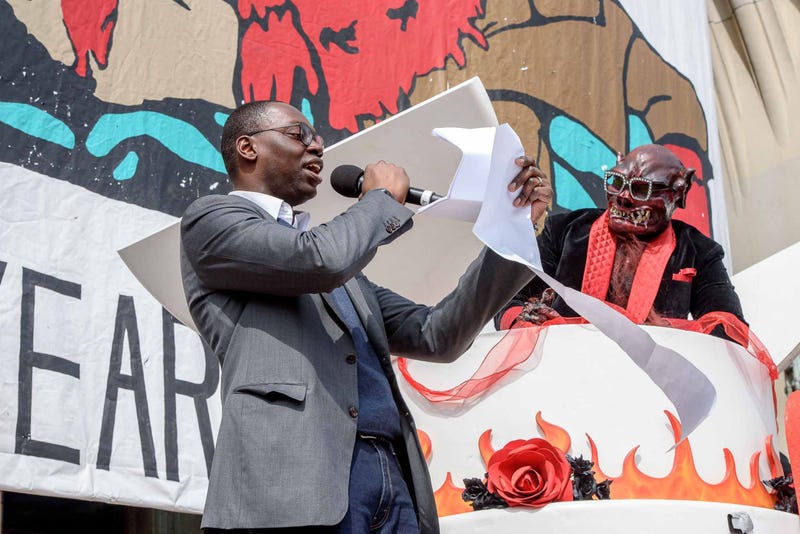 Garland Gilchrist welcomes the the Nain Rouge on the steps of Masonic Temple at the conclusion of the 10th annual Marche du Nain Rouge in 2019.