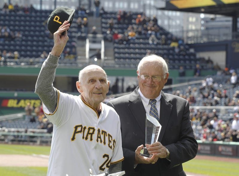 Pittsburgh Pirates former shortstop Dick Groat (left) reacts as he is presented an award by former pitcher Steve Blass (right) before the Pirates play the St. Louis Cardinals at PNC Park.