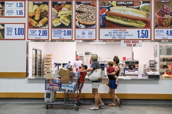 People ordering lunch at a Costco food court