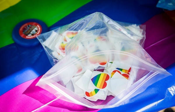 Plastic bag full of heart-shaped rainbow stickers