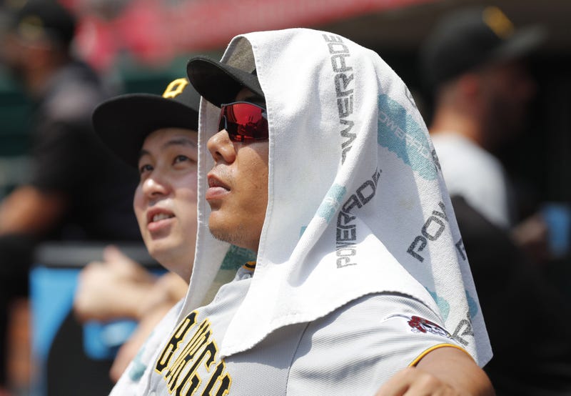 Jul 31, 2019; Cincinnati, OH, USA; Pittsburgh Pirates infielder Jung Ho Kang (16) watches from the dugout against the Cincinnati Reds