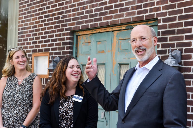 Pennsylvania Gov. Tom Wolf speaks outside the old Montgomery Ward building on Frederick Street during a tour of downtown Hanover on Tuesday, August 6, 2019. Mari 06