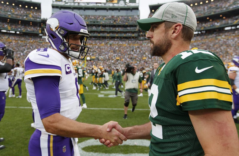 Kirk Cousins and Aaron Rodgers shake hands