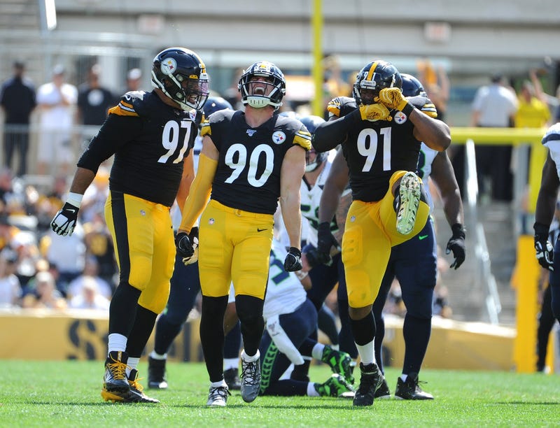  Pittsburgh Steelers linebacker T.J. Watt (90) celebrates a sack of Seattle Seahawks quarterback Russell Wilson (3) with teammates Cameron Heyward (97) and Stephon Tuitt (91) 