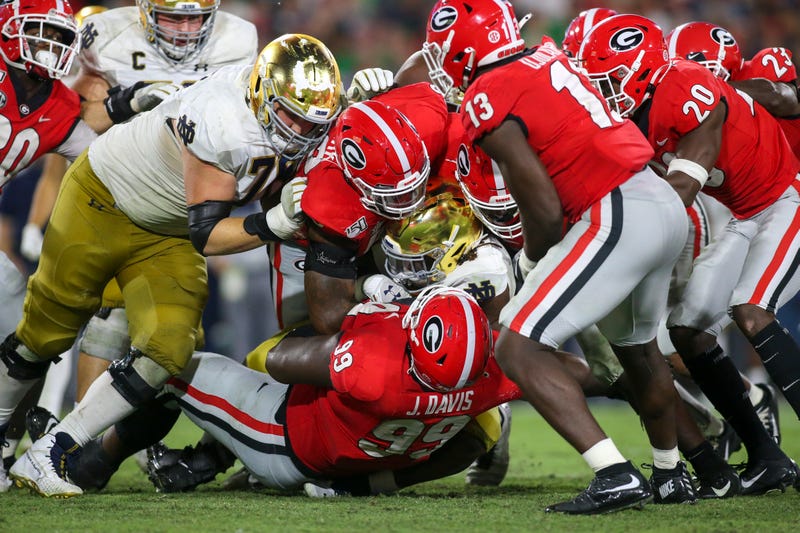 The Notre Dame Fighting Irish face the Georgia Bulldogs at Sanford Stadium
