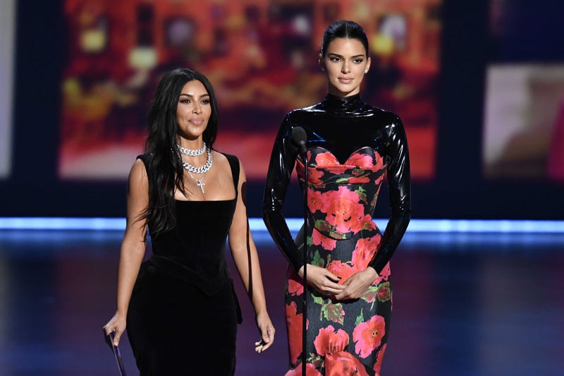 ; Kim Kardashian (L) and Kendall Jenner present the award for best competition program during the 71st Emmy Awards at the Microsoft Theater.