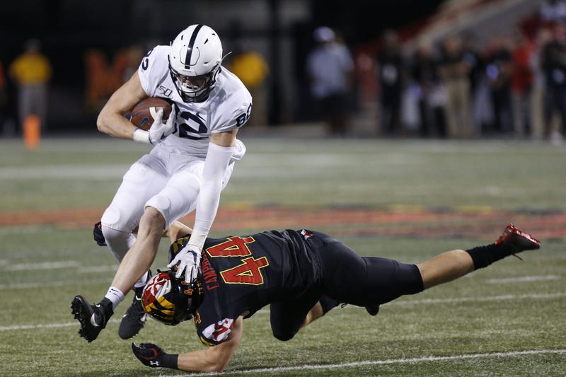 Penn State Nittany Lions tight end Zack Kuntz (82) runs with the ball past the tackle of Maryland Terrapins linebacker Chance Campbell (44) in the fourth quarter at Capital One Field at Maryland Stadium.