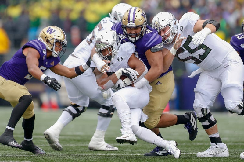 Washington and Oregon football teams.