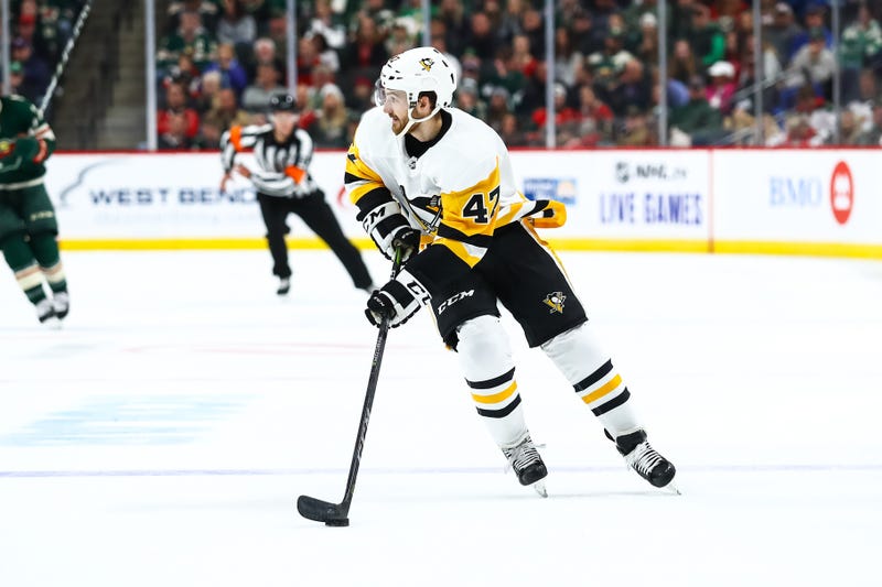 Pittsburgh Penguins center Adam Johnson (47) skates with the puck in the first period against the Minnesota Wild