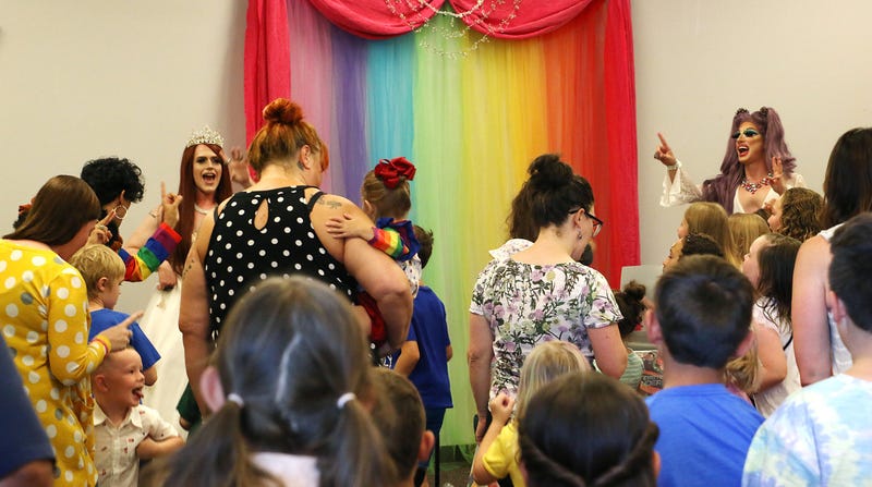 Ginger Devine, left, and Aspen Meadows entertain those gathered for a successful 2019 Drag Queen Story Hour at the Sparks Library in Nevada. 