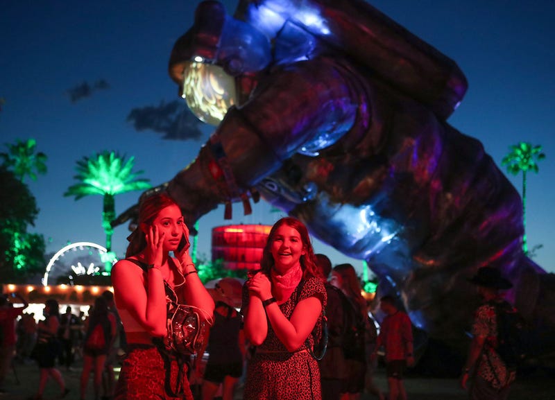 FILE - Festival goers at the Coachella Valley Music and Arts Festival in Indio, Calif. on April 19, 2019.