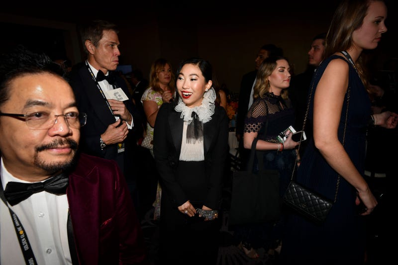 Awkwafina, up for best actress in a comedy or musical for \"The Farewell, walks into the ballroom at the 2020 Golden Globe Awards.