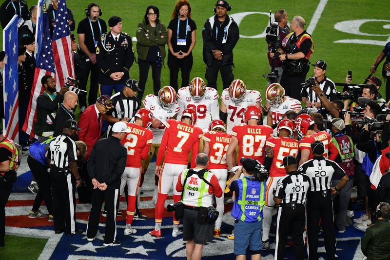 San Francisco 49ers and Kansas City Chiefs stand on the 50 yard line for the coin toss prior to the game between the San Francisco 49ers and the Kansas City Chiefs in Super Bowl LIV at Hard Rock Stadium