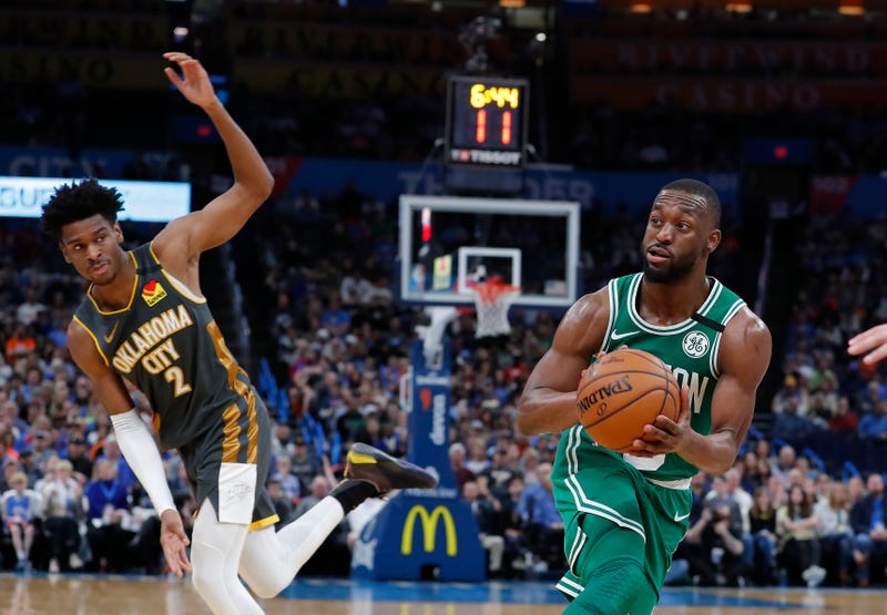 Kemba Walker drives past Shai Gilgeous-Alexander.