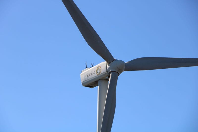 A small 2-megawatt wind turbine spins above the University of Delaware campus in Lewes, Delaware.