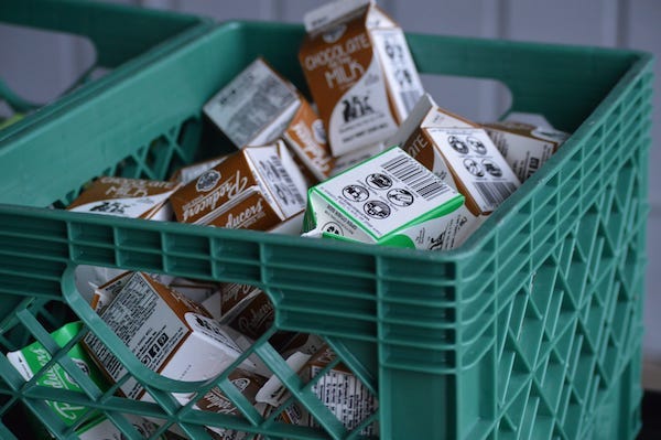 Boxes of regular and chocolate milk were prepared for students at Shasta Meadows Elementary School