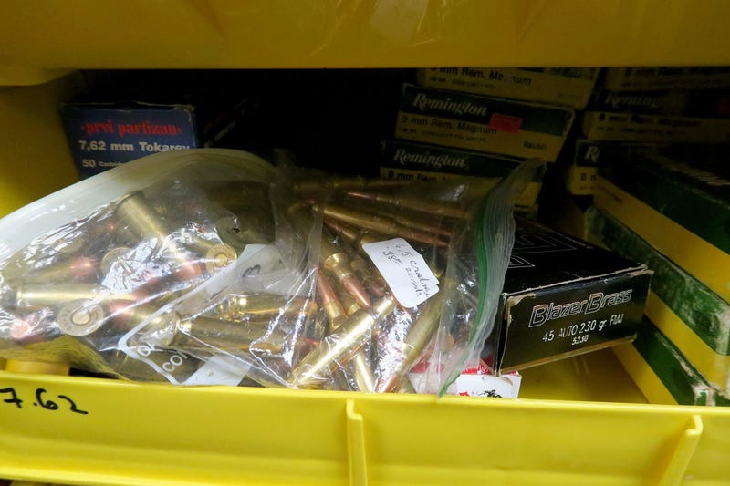 Bins of ammunition for sale.