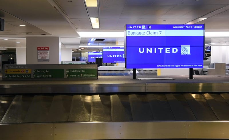 Boy Goes For A Ride At MSP Baggage Belts