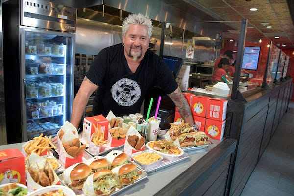 Chef Guy Fieri was at Chicken Guy! at Disney Springs Monday for a special ribbon-cutting ceremony