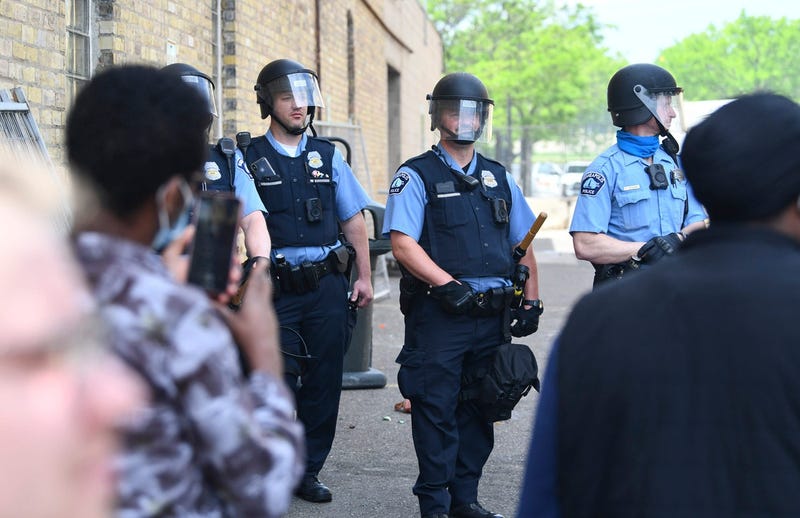 Police officers form a line in an alley next to the Minneapolis Police Department s Third Precinct headquarters at the Intersection of Hennepin Ave. and Lake Street Thursday, May 28, 2020, in Minneapolis.