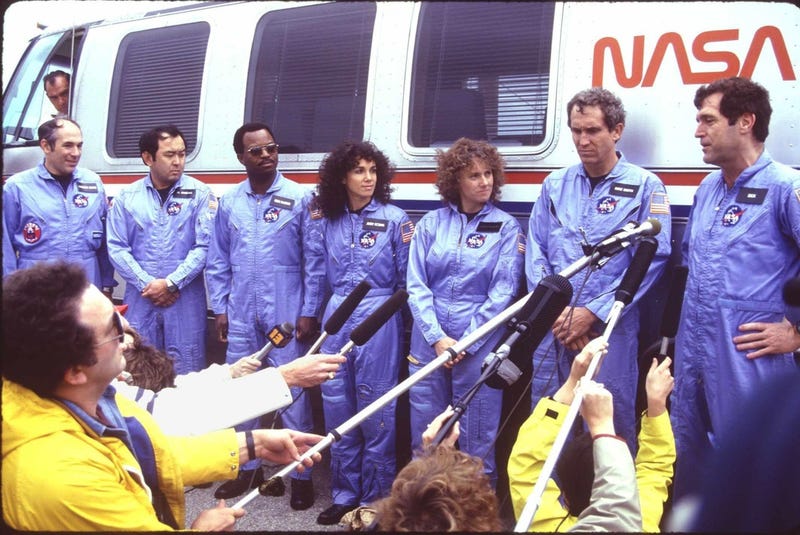 Space shuttle Challenger crew meeting the media at the launch pad