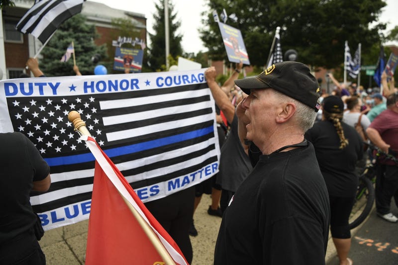 Edward Durfee, a U.S. Marine veteran from Northvale, salutes during the singing of the National Anthem during a first responders appreciation rally in front of Fair Lawn borough hall on Monday, August 3, 2020.