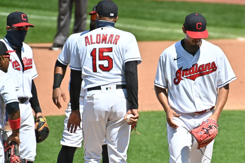 Aug 23, 2020; Cleveland, Ohio, USA; Cleveland Indians acting manager Sandy Alomar Jr. (15) relieves starting pitcher Carlos Carrasco (right) during the fourth inning against the Detroit Tigers at Progressive Field. Mandatory Credit: Ken Blaze-USA TODAY Sports