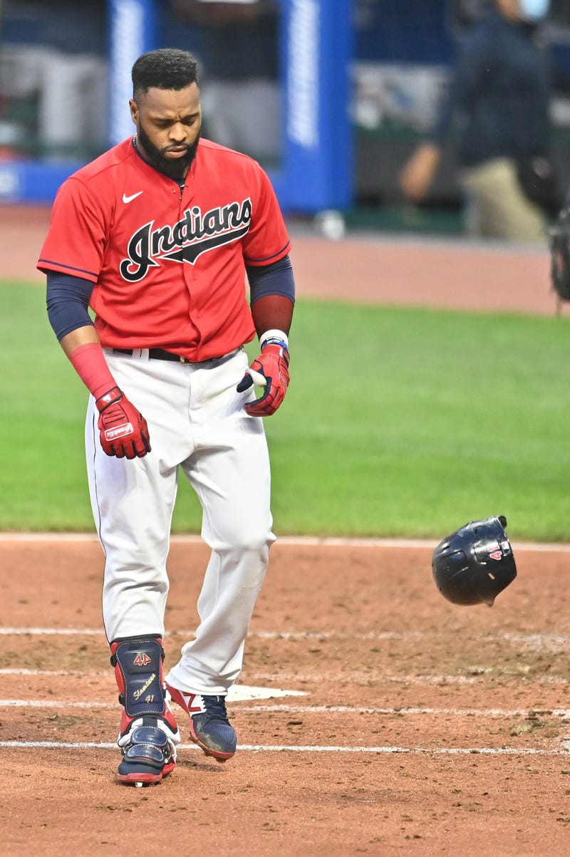 Cleveland Indians first baseman Carlos Santana (41) throws his helmet after striking out to end the third inning against the Minnesota Twins at Progressive Field.