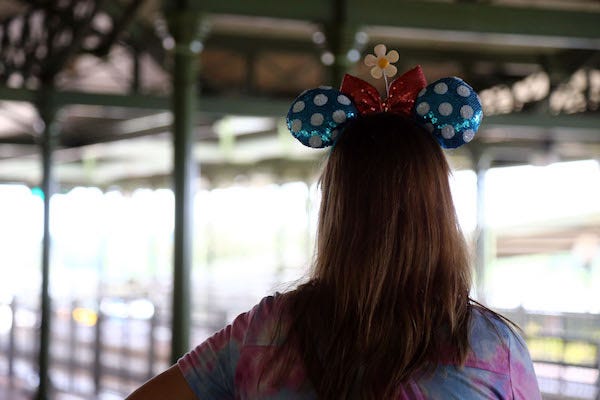 Woman wearing Minnie Mouse ears at Magic Kingdom