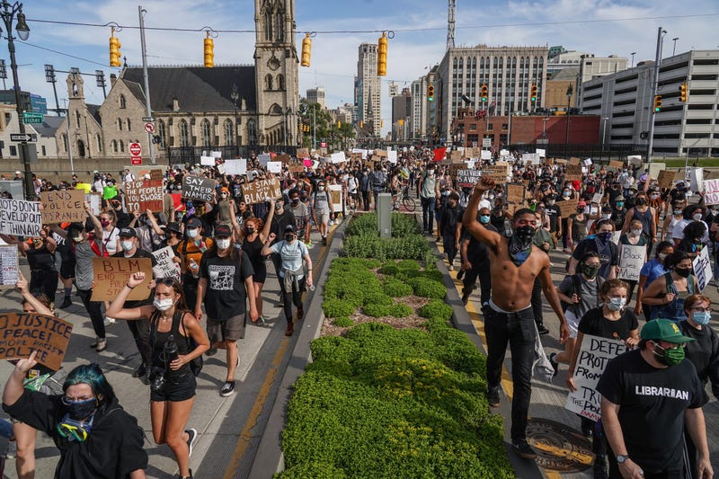 Protesters march up Woodward Avenue in the spring of 2020.
