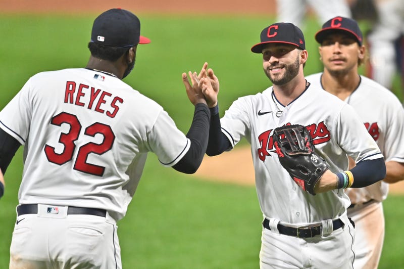 Sep 7, 2020; Cleveland, Ohio, USA; Cleveland Indians designated hitter Franmil Reyes (32) and right fielder Tyler Naquin (30) celebrate after the Indians beat the Kansas City Royals at Progressive Field. Mandatory Credit: Ken Blaze-USA TODAY Sports