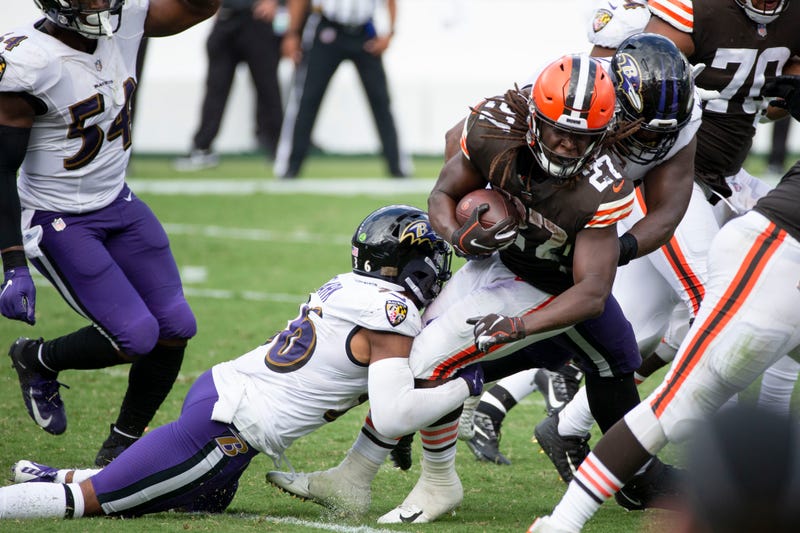 A group of Ravens tackle Browns RB Kareem Hunt during Baltimore's season opening beatdown of Cleveland in September.