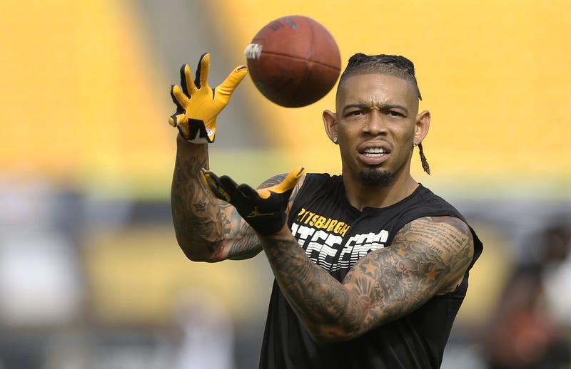 Haden catching passes out of uniform