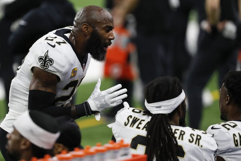 New Orleans Saints strong safety Malcolm Jenkins (27) talks to safety Chauncey Gardner-Johnson (right) on the sideline