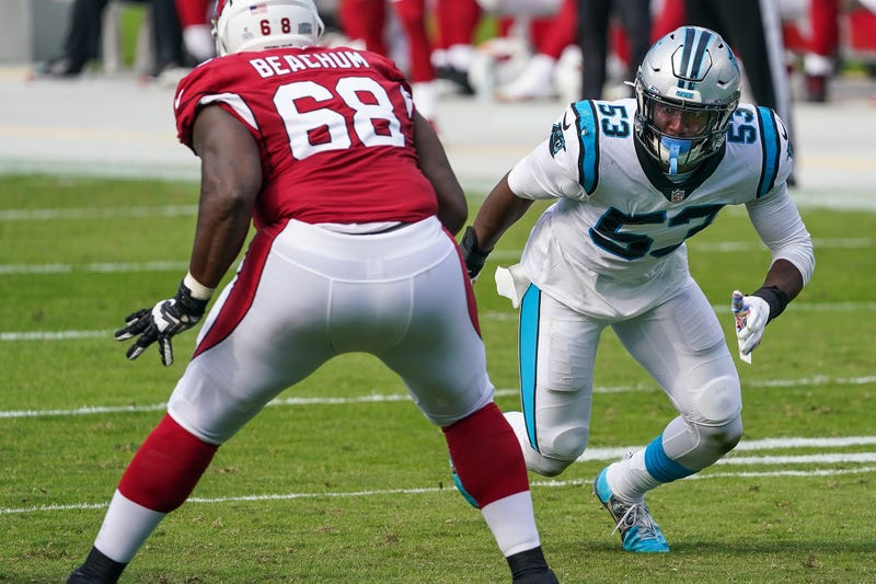 Brian Burns attempts to go around OL Kelvin Beachum