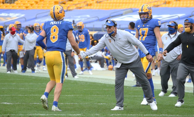 Pat Narduzzi slaps hand of Kenny Pickett