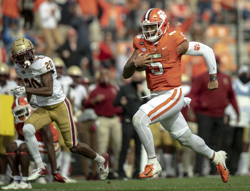 Clemson Tigers quarterback D.J. Uiagalelei (5) runs for a 30-yard touchdown against the Boston College Eagles during the third quarter at Memorial Stadium.