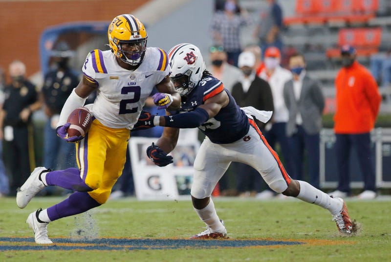 Then-LSU Tigers tight end Arik Gilbert (2) is tackled by Auburn Tigers linebacker Cam Riley (35) during the fourth quarter at Jordan-Hare Stadium. 