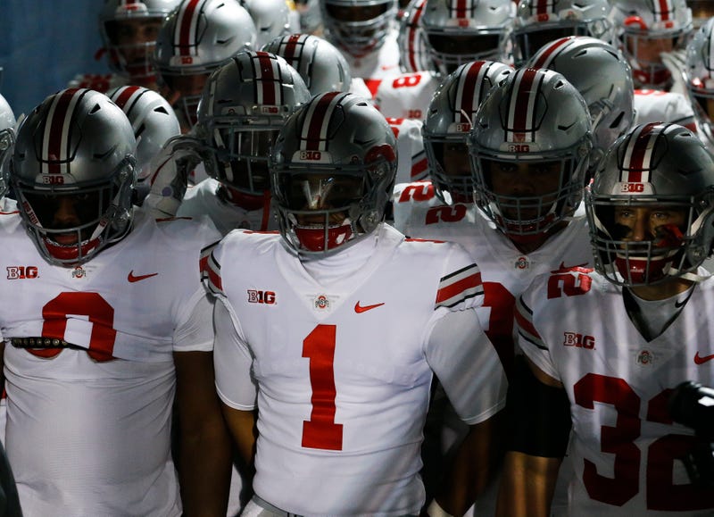Justin Fields (1) prepares to lead the Buckeyes onto the field