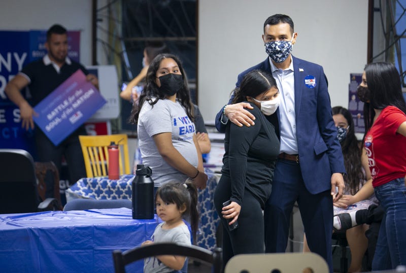 Arizona State Senator Tony Navarrete hugs his niece, Esmerelda Castro of Phoenix, during a watch party at the Maricopa County Democratic Party offices in Phoenix on Election Day on November 3, 2020.