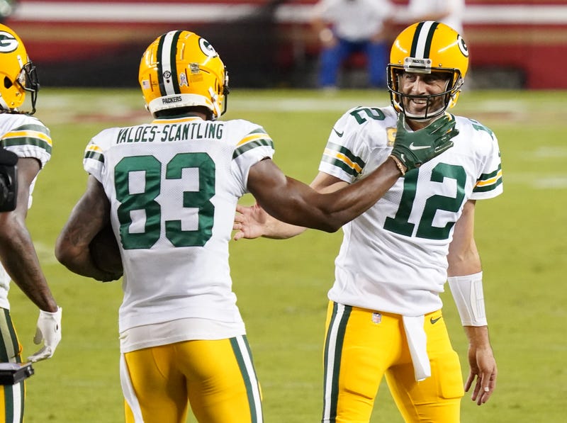 Packers teammates Aaron Rodgers and Marquez Valdes-Scantling celebrate a touchdown.