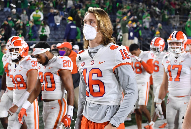 Clemson Tigers quarterback Trevor Lawrence (16) leaves the field with his teammates after Clemson lost to Notre Dame 47-40 in two overtimes at Notre Dame Stadium.