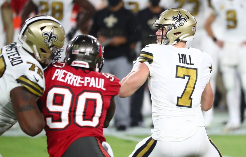 New Orleans Saints quarterback Taysom Hill (7) drops back to pass against the Tampa Bay Buccaneers in the first quarter of a NFL game at Raymond James Stadium.