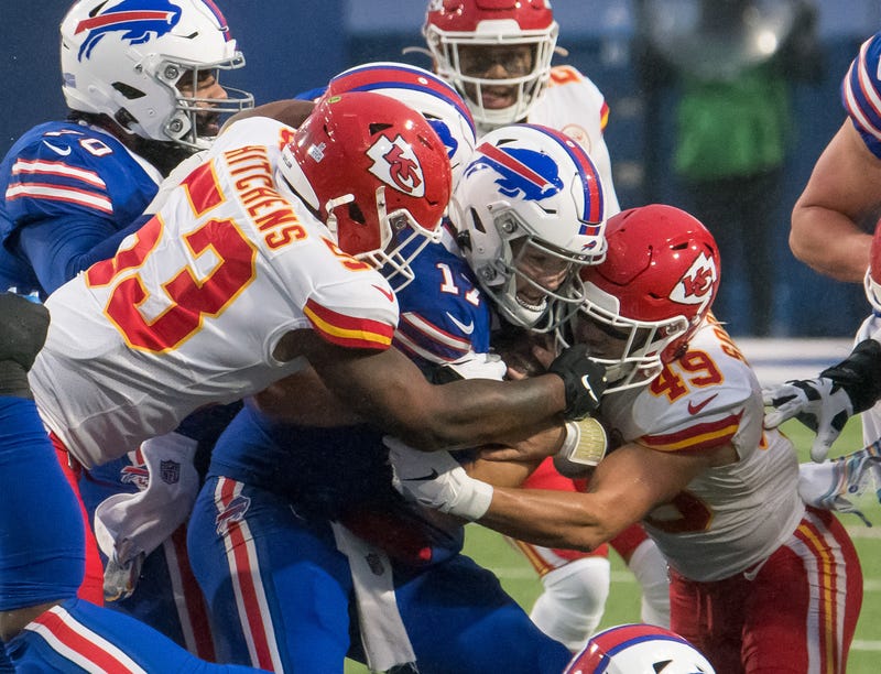 Chiefs defenders gang-tackle Bills QB Josh Allen during a Week 6 matchup.