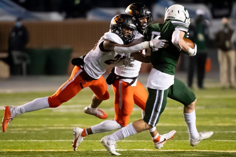 Cathedral Prep defenders chase down a Pine-Richland ball carrier in the PIAA Class 5A championship at Hersheypark Stadium on Friday, November 27, 2020