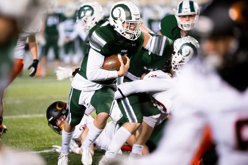 Pine-Richland quarterback Cole Spencer takes off on a run against Cathedral Prep in the PIAA Class 5A championship