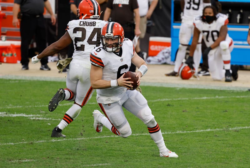 Cleveland Browns quarterback Baker Mayfield (6) rolls out as running back Nick Chubb (24) protects during the second half against the Jacksonville Jaguars at TIAA Bank Field. 